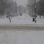 Woman walking away, Esplanade, formal park in Helsinki, in winter. Lots of snow.
