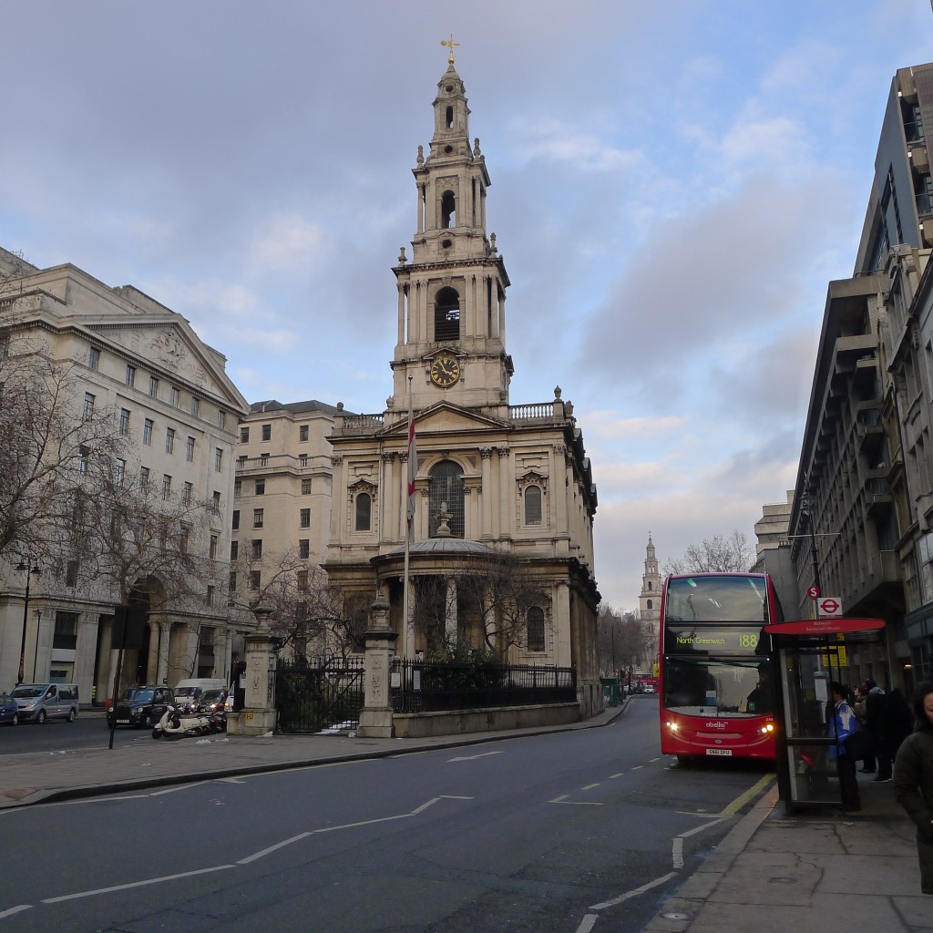London church and red double decker bus