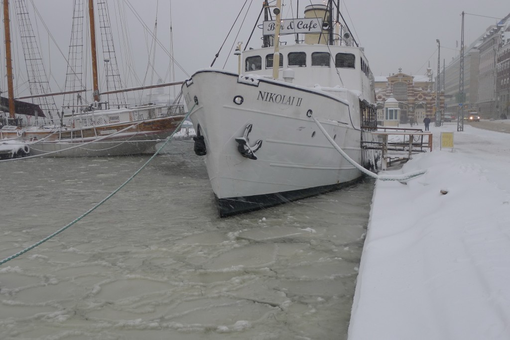White ship about 40 feet, in icy water