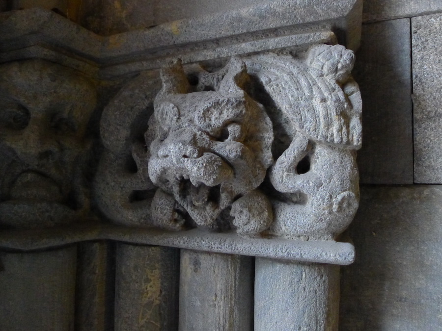 stone carved gargoyle's face snarling