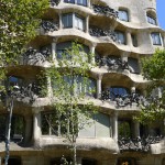 Part of an unusual apartment building showing rows of windows in a flowing matrix reminiscent of a honeycomb