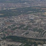 Looking down from airplane at clearly visible buildings, parks and streets of Hyde Park and Kensington in London